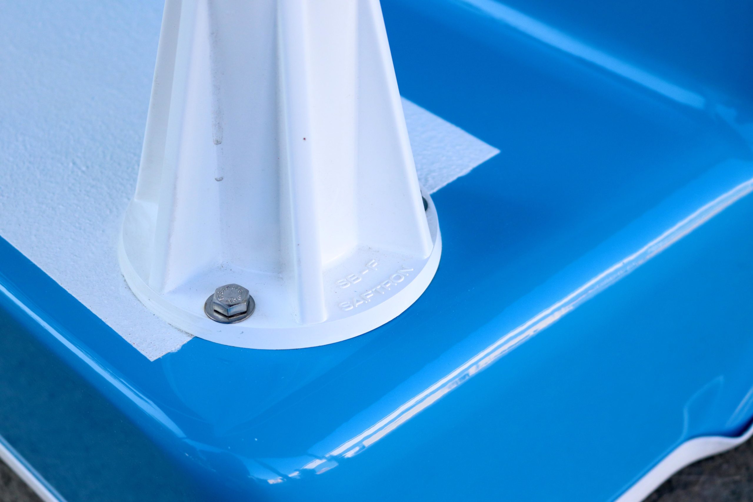 Close-up of the safety bar connection to pool stair tread