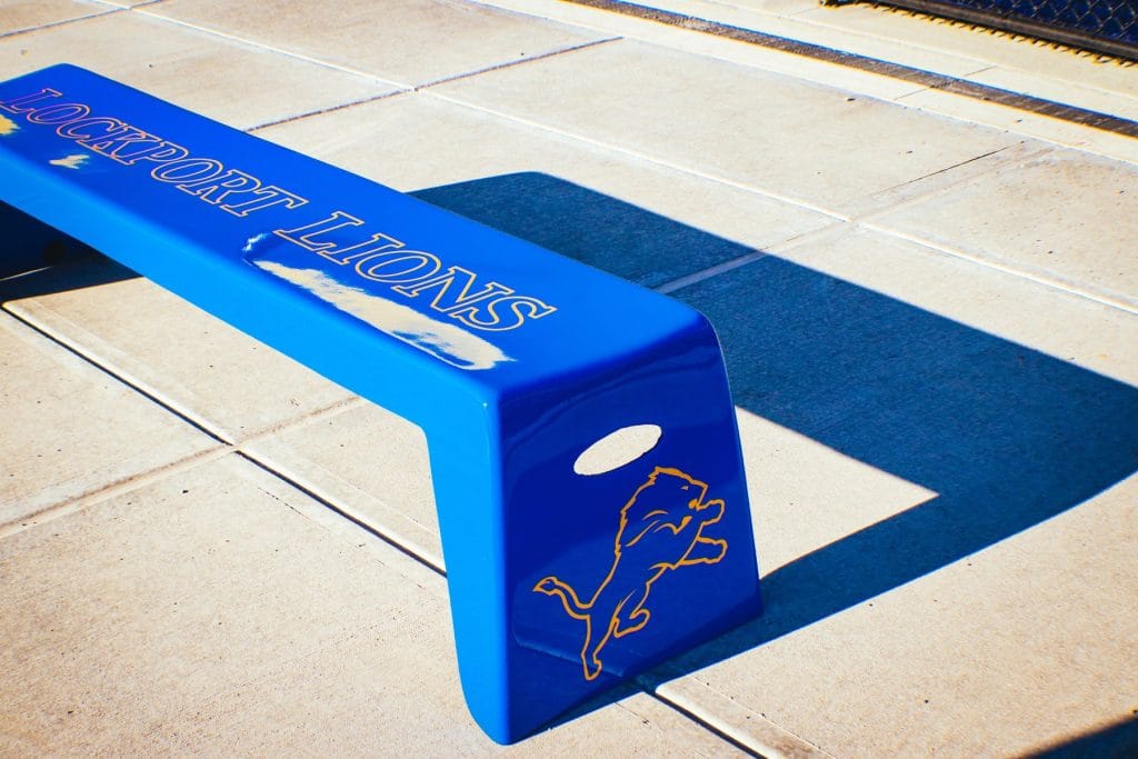 Blue Easy Stack Bench with Lockport Lions graphics outdoors